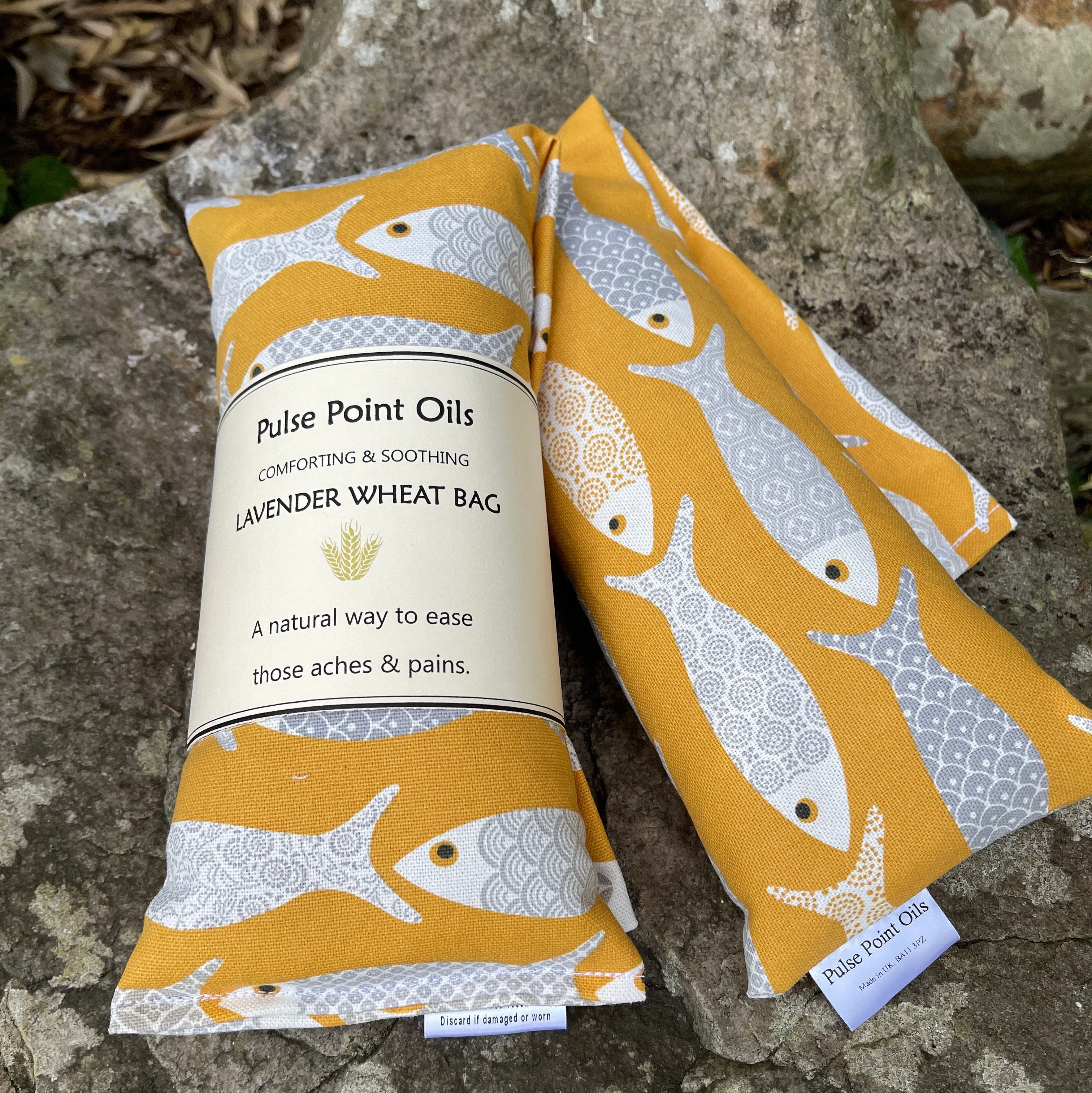 Long lavender scented wheat bags, in a yellow floral fish print. Holistic heat pad for aches and pains. New mum care package heat wrap.