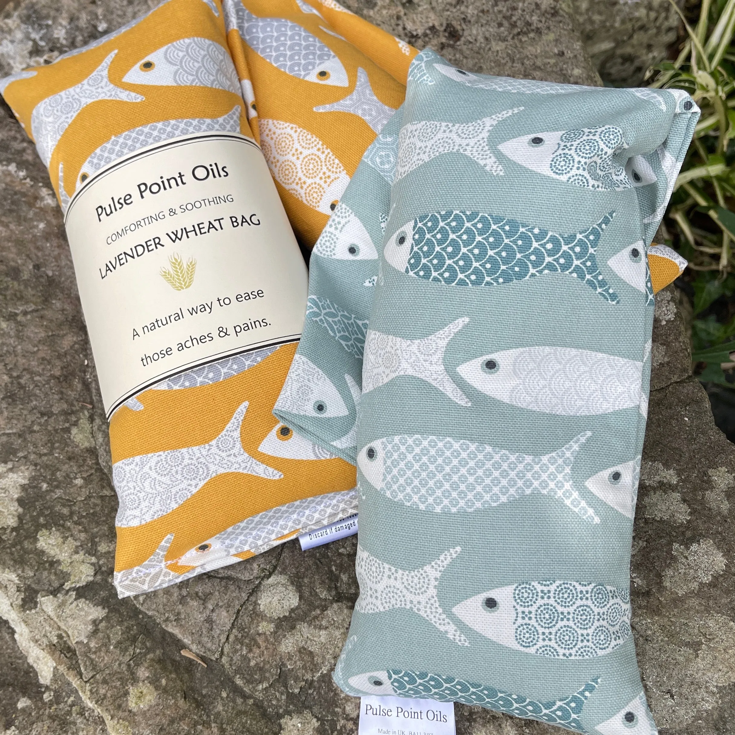 Long lavender scented wheat bags, in a yellow floral fish print. Holistic heat pad for aches and pains. New mum care package heat wrap.